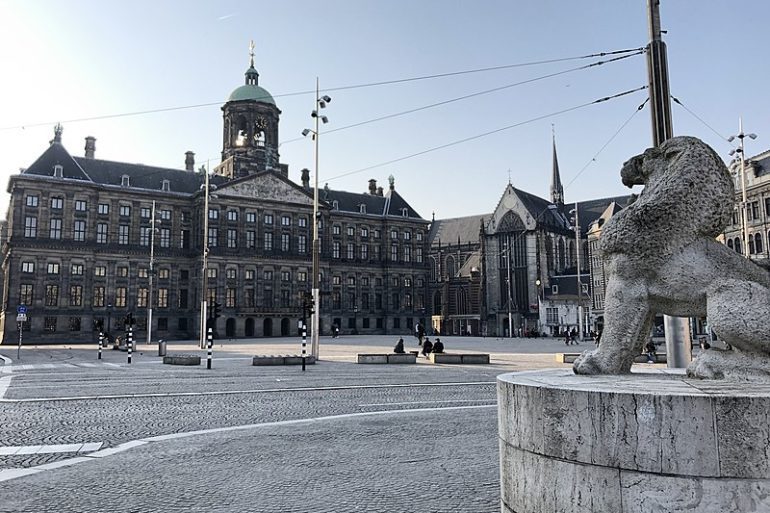 Amsterdam's Dam Square and Royal Palace empty due to lockdown.
