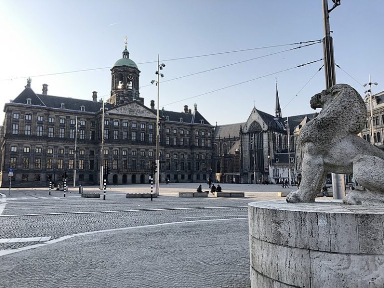 Amsterdam's Dam Square and Royal Palace empty due to lockdown.