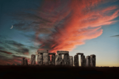 A picture of Stonehenge around dusk; clouds overhead are tinted red and on the left a crescent moon is visible.